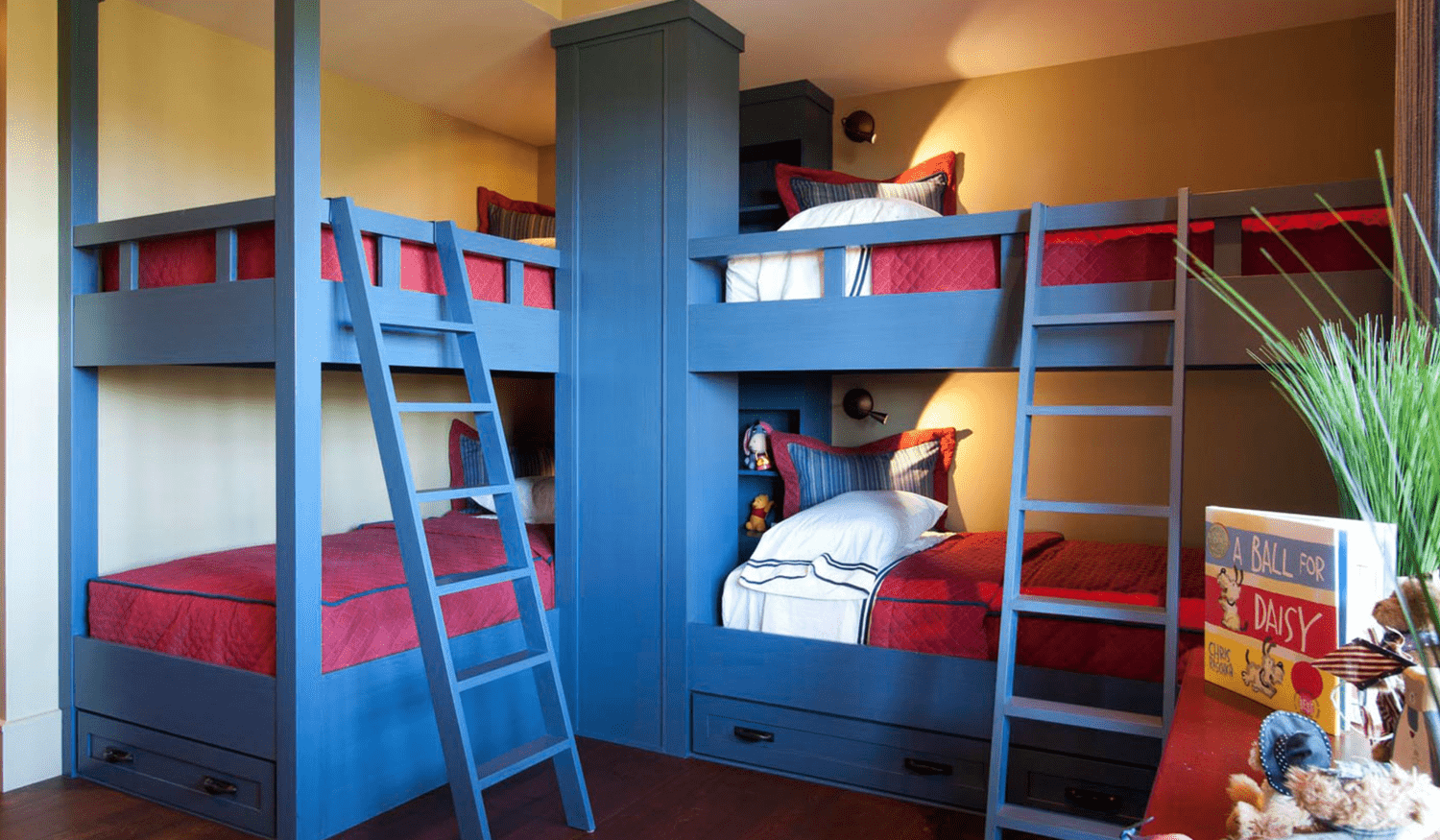 Blue built-in bunk beds with ladder and storage