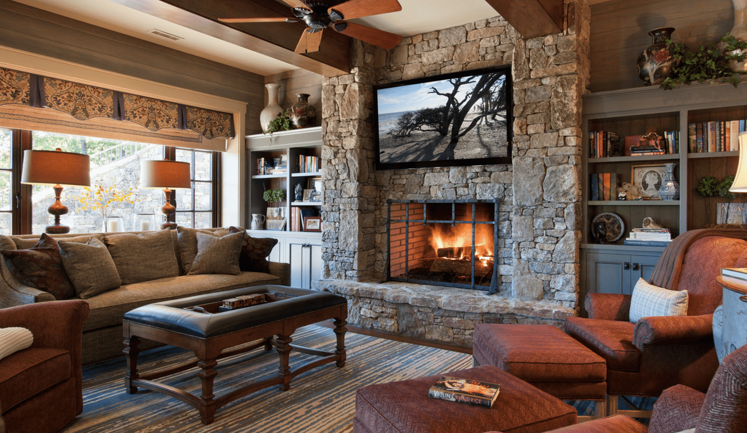Living room built-ins around fireplace and television