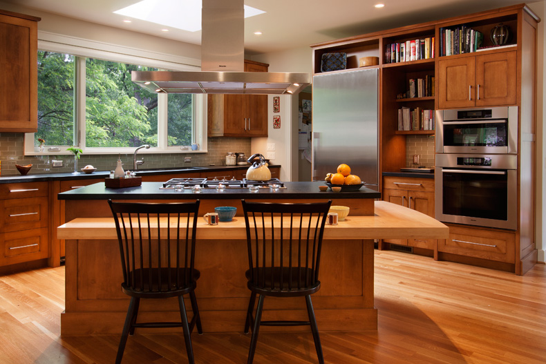 Wood kitchen cabinetry with island from a Google business photo