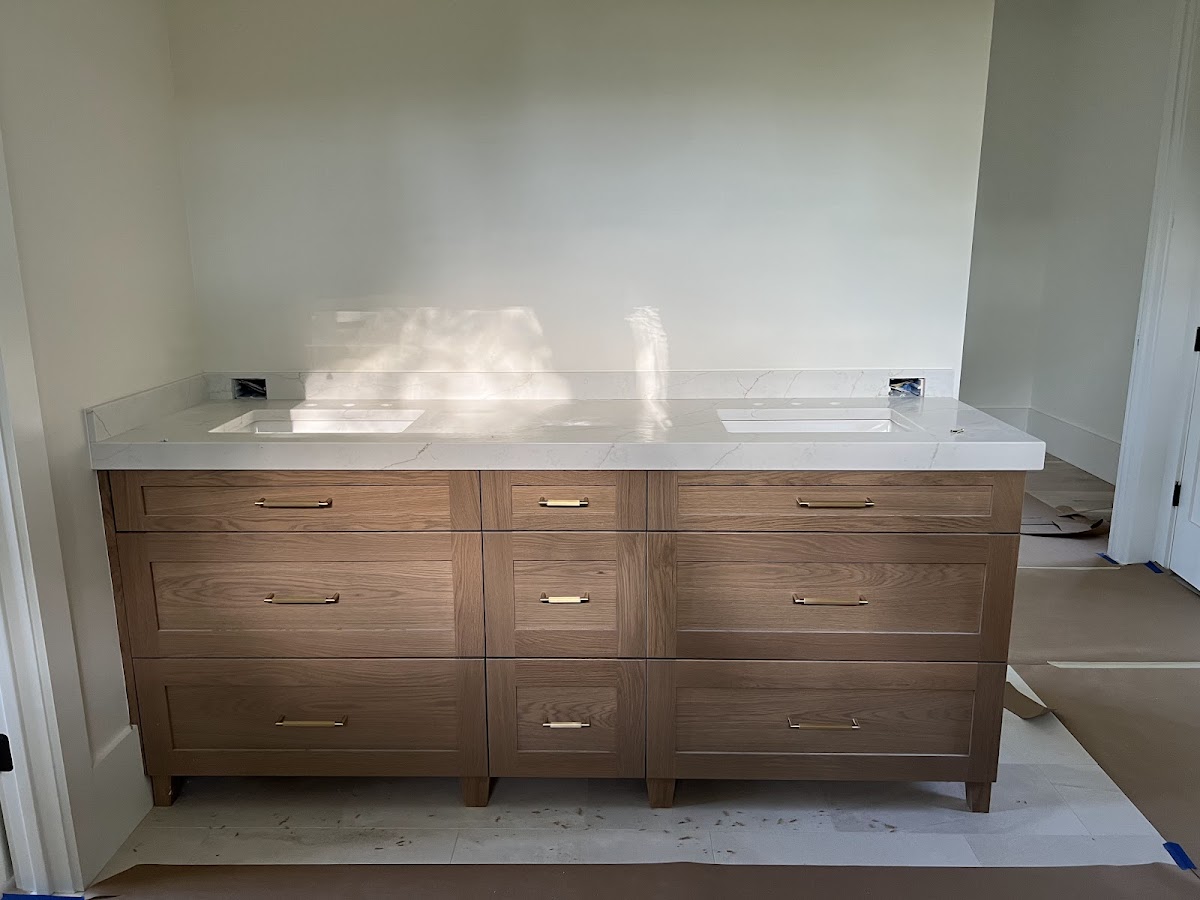 Wood vanity cabinetry from a Google review photo
