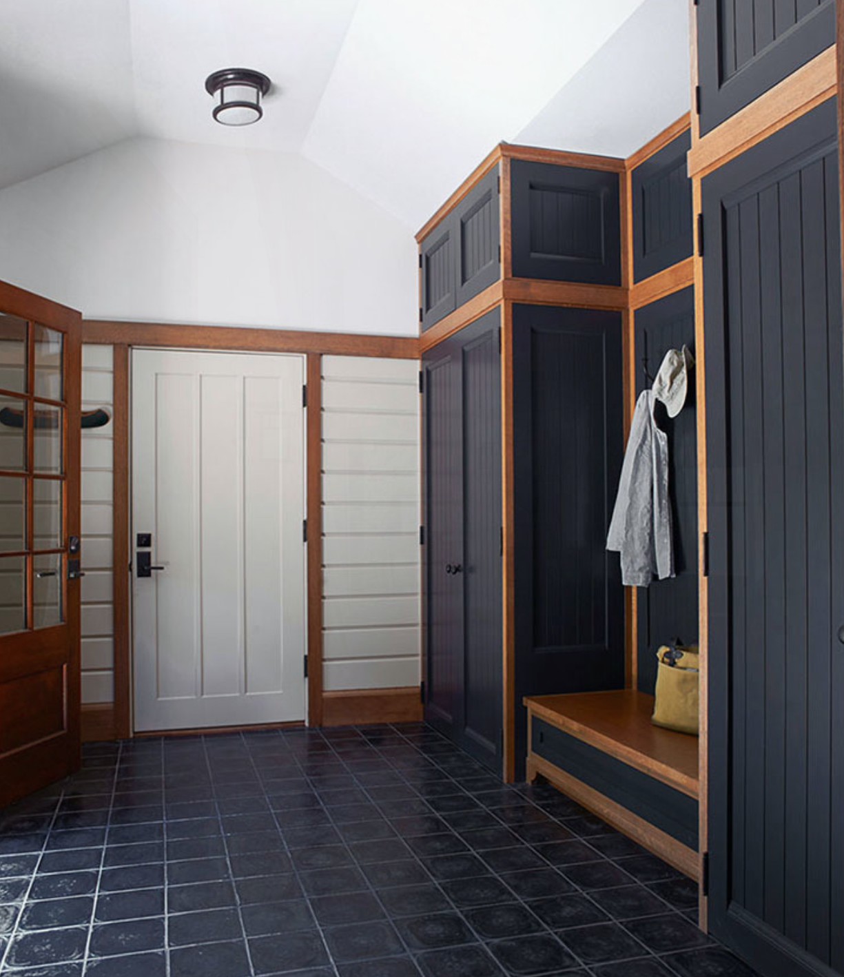 Mudroom cabinetry with open storage cubbies