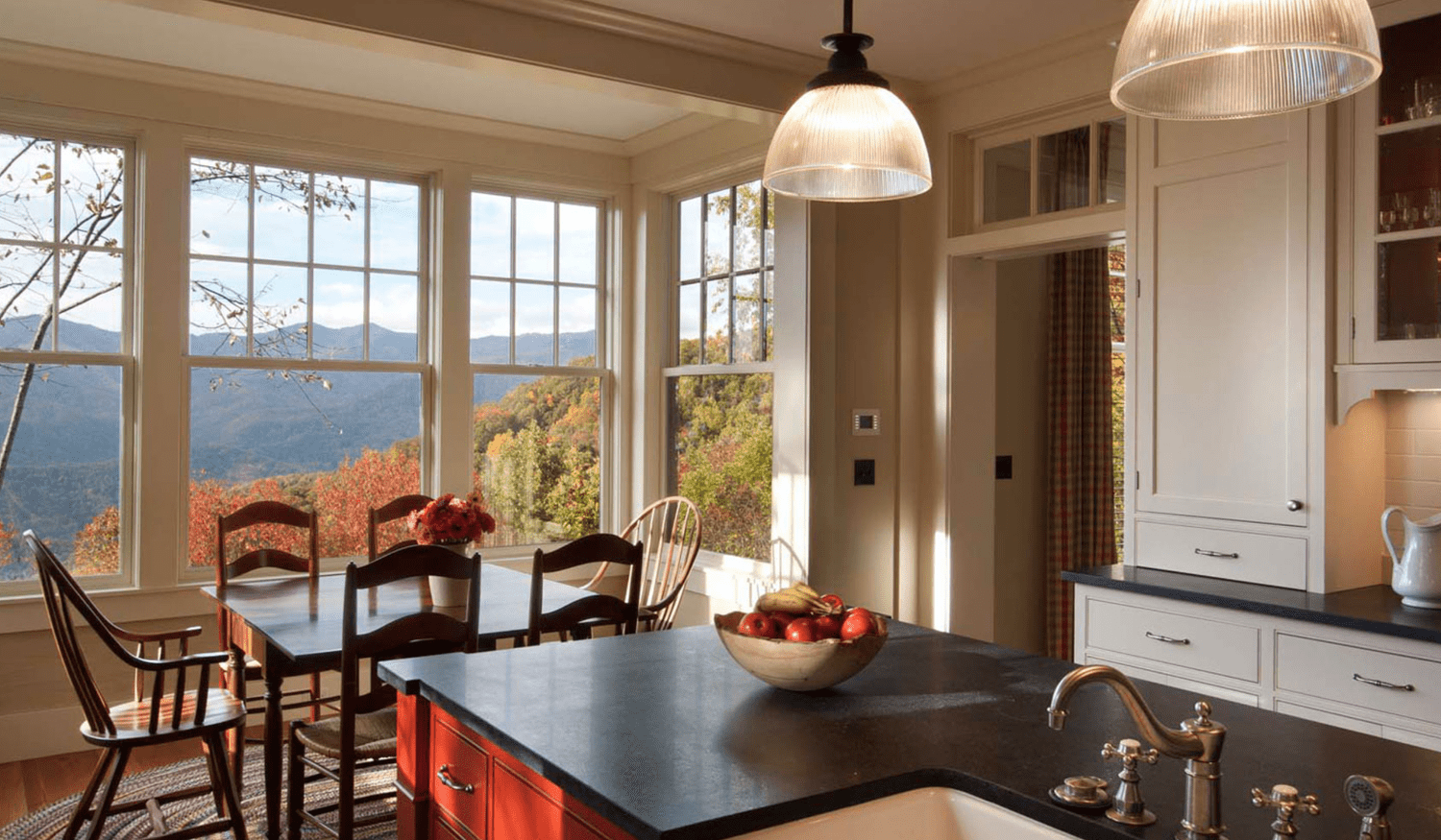 Bright mountain kitchen with cream cabinetry and island